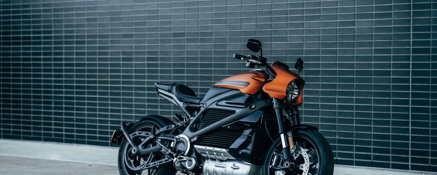 harley davidson sports bike against black brick wall